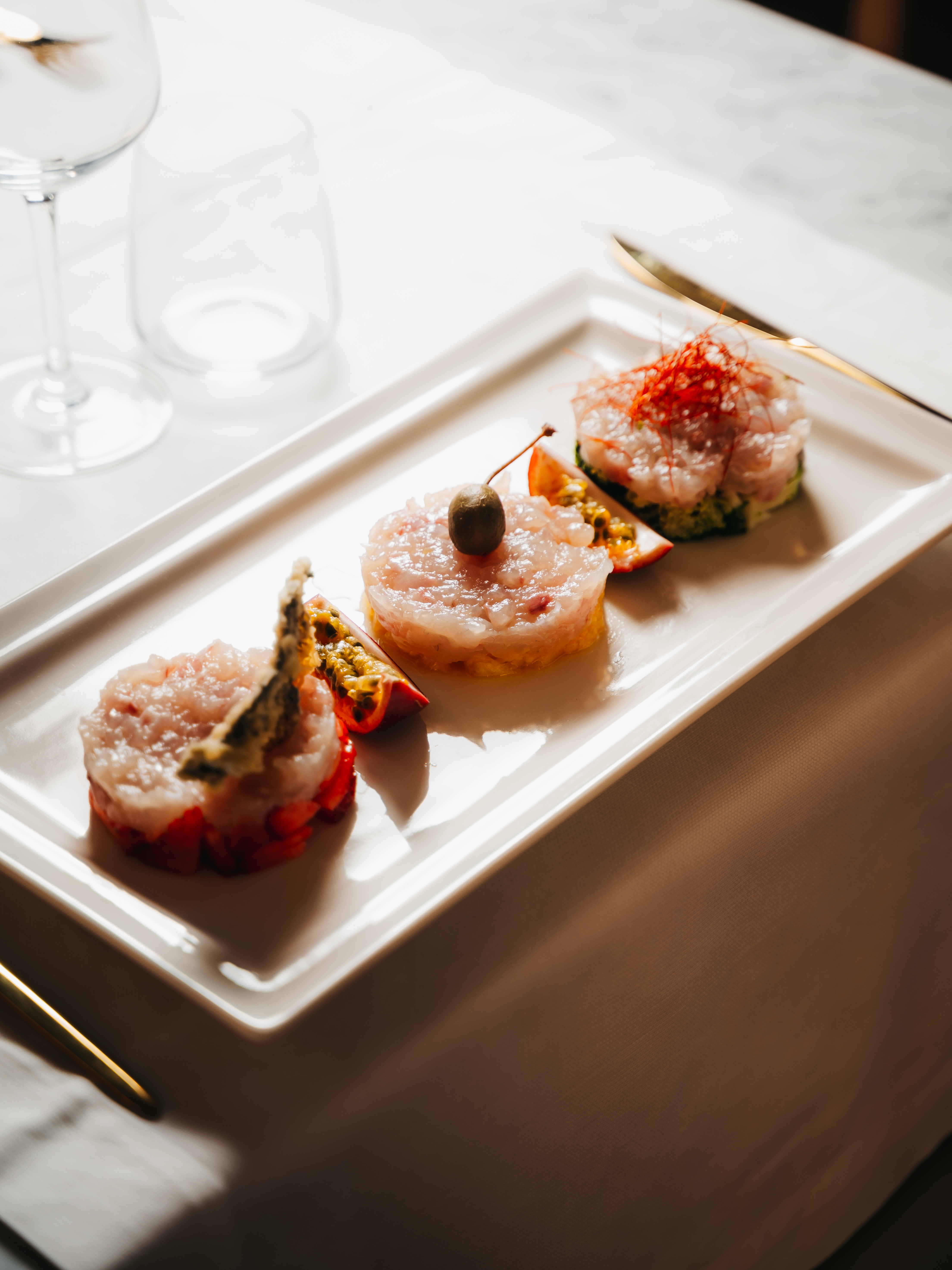 Tris di tartare di pesce